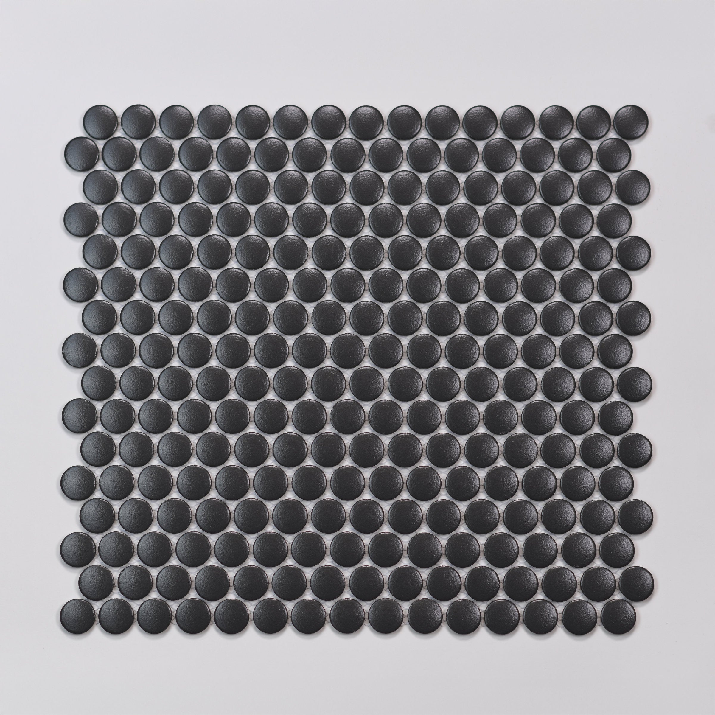 Bedrosians Marin 3/4" Penny Round Matte Porcelain Mosaic in Black Sea | Item Code 100004040